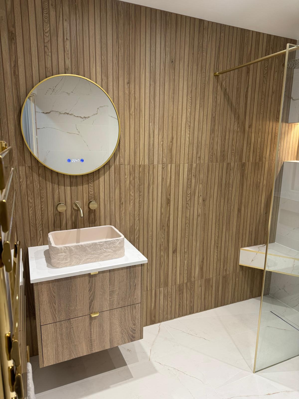 Contemporary bathroom installation with walk-in shower and floating vanity unit by MDS NE
